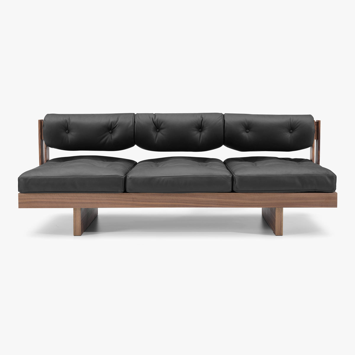 BASSO three-seat sofa in black semi-aniline leather with walnut frame, front studio view