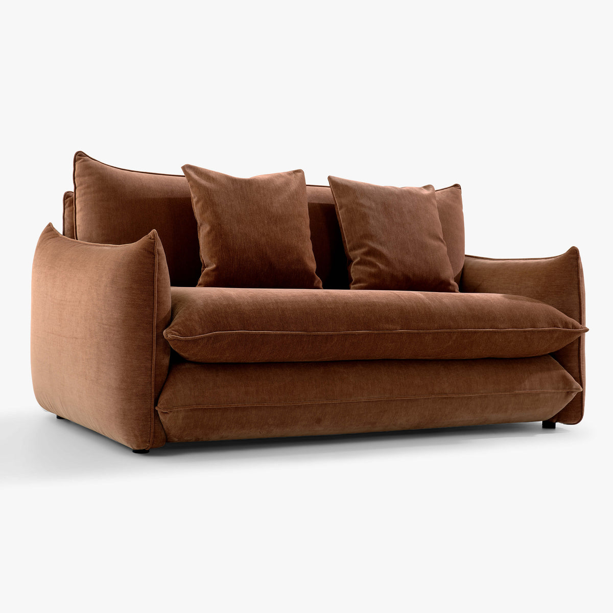 Angled front view of the Blossom sofa bed in Bronze with curved arms, back cushions and two decorative cushions.