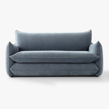 Front view of the Blossom sofa bed in Celestine, showing its curved arms and upholstered seat and back cushions.