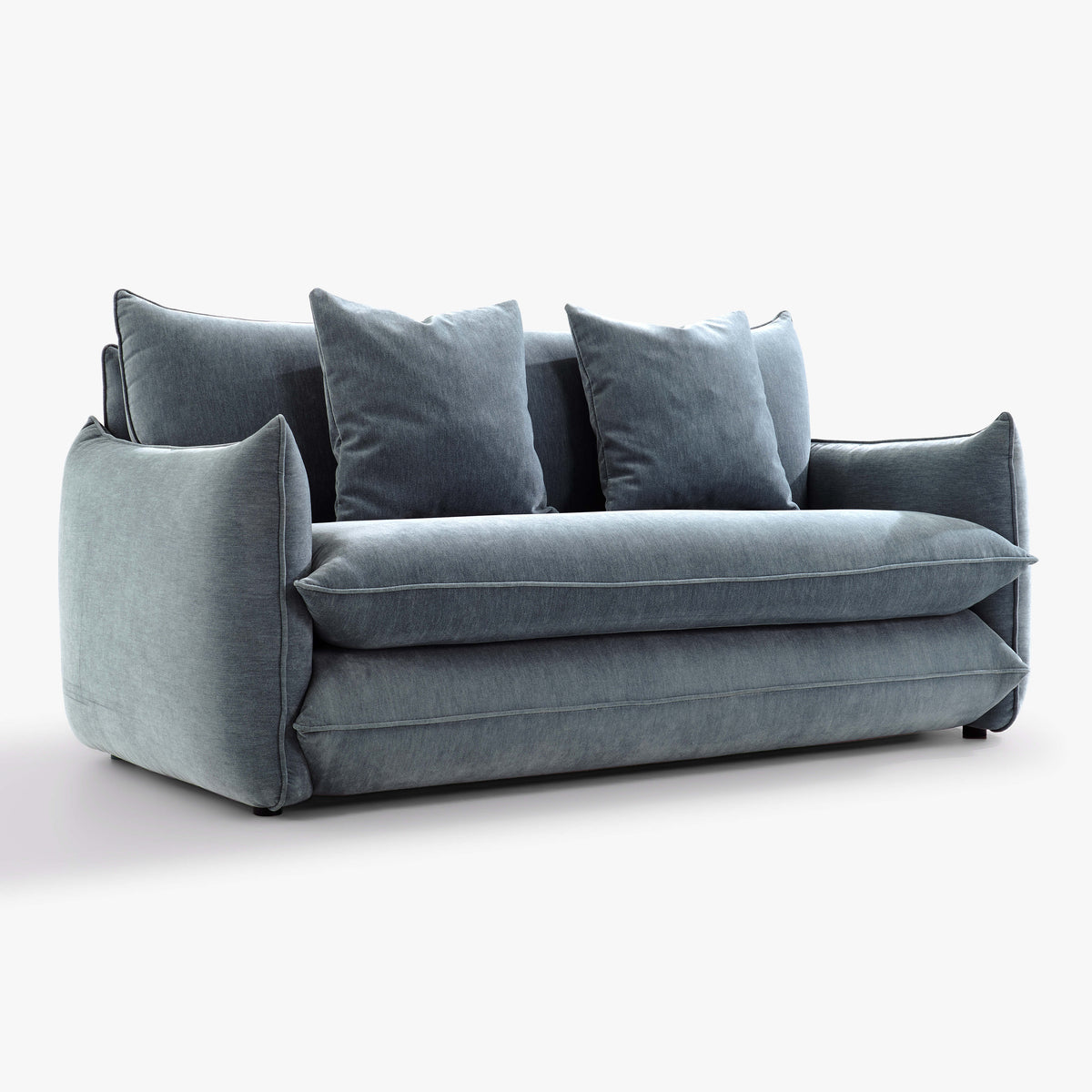 Angled front view of the Blossom sofa bed in Celestine with curved arms, back cushions and two decorative cushions.