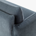 Close-up of the Blossom sofa bed in Celestine, showing the curved arm, cushion edges and stitched upholstery detail.