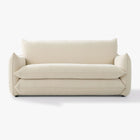Front view of the Blossom sofa bed in Bisque, showing its curved arms and upholstered seat and back cushions.