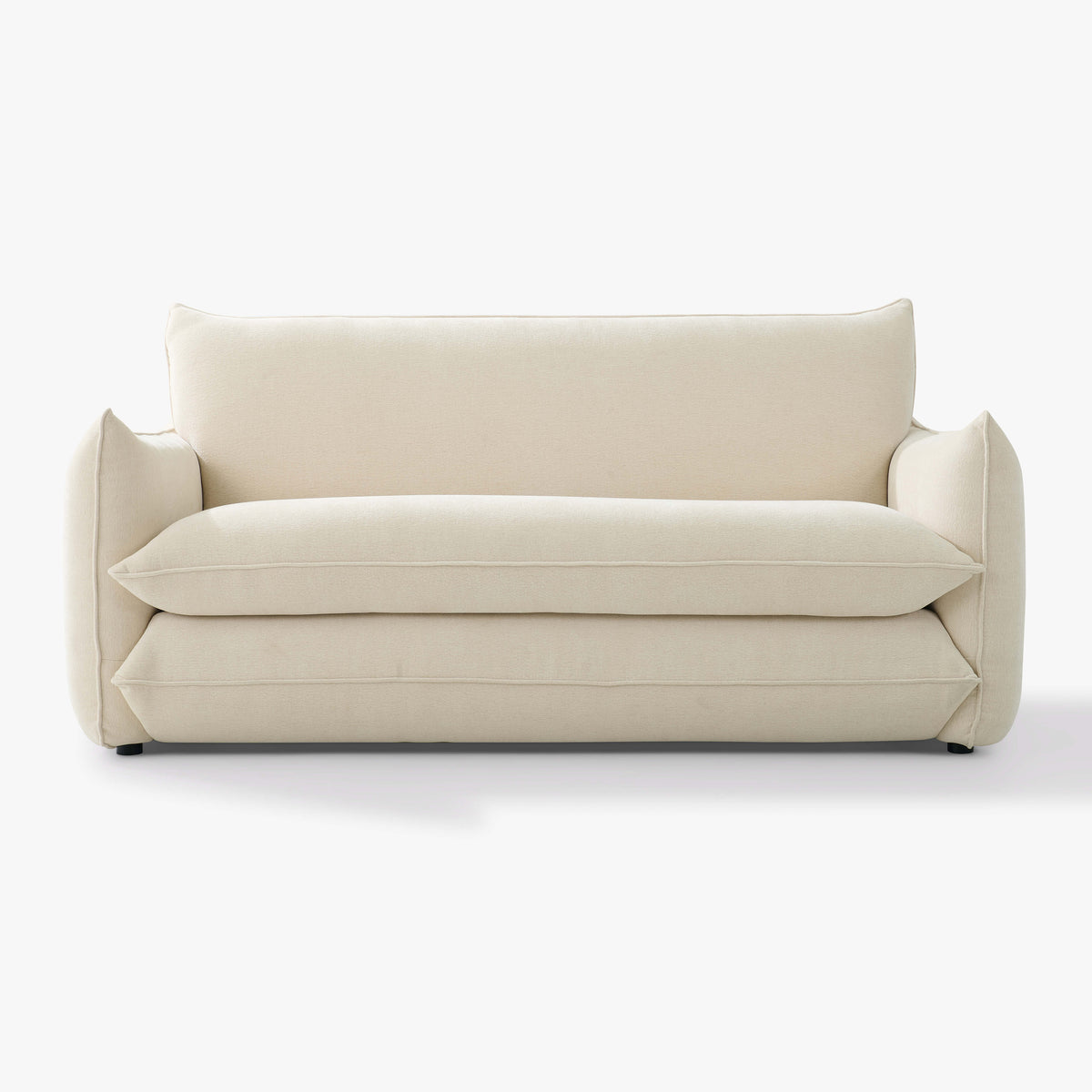 Front view of the Blossom sofa bed in Bisque, showing its curved arms and upholstered seat and back cushions.