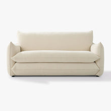 Front view of the Blossom sofa bed in Bisque, showing its curved arms and upholstered seat and back cushions.