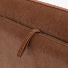 Close-up of the Blossom sofa bed in Bronze, showing the fabric pull loop and stitched upholstery.