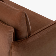 Close-up of the Blossom sofa bed in Bronze, showing the curved arm, cushion edges and stitched upholstery detail.