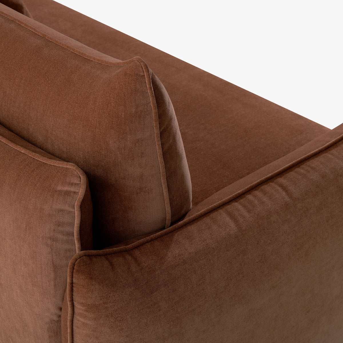 Close-up of the Blossom sofa bed in Bronze, showing the curved arm, cushion edges and stitched upholstery detail.