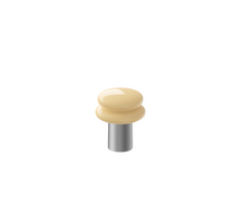 Portable lamp with a butter yellow shade and silver coloured base on a white background