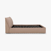 Side view of the Dormi queen bed frame in Quarry upholstery.