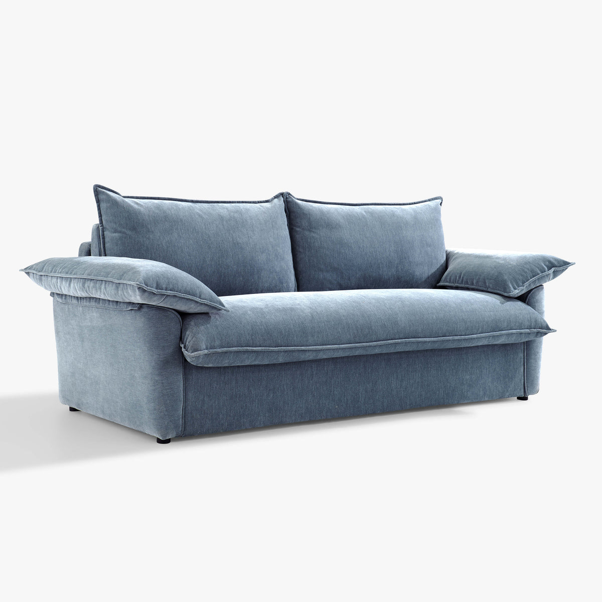 Angled front view of the Ease sofa bed in Celestine, showing its upholstered seat, two back cushions and cushioned arms.