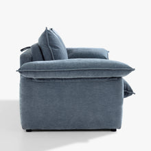 Side view of the Ease sofa bed in Celestine, showing the cushioned arm, upholstered base and back cushions.