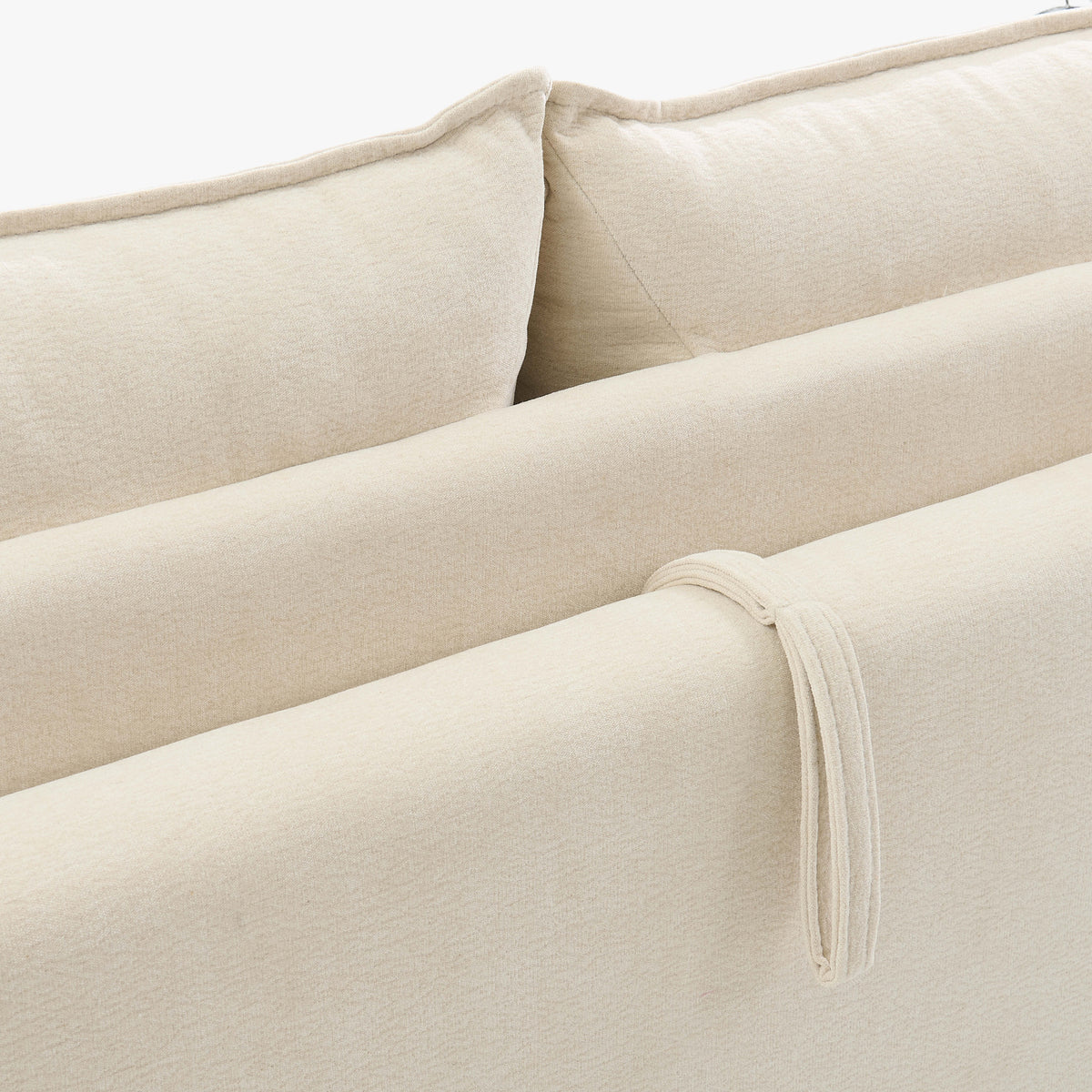 Close-up of the Ease sofa bed in Bisque, showing textured upholstery, back cushions and the fabric pull loop.