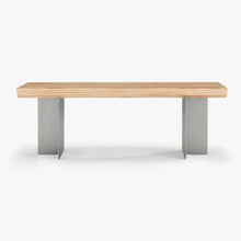 Front view of the Forma Atelier bench seat showing the long Douglas fir seat and two stainless steel supports.