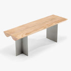 Elevated three-quarter view of the Forma Atelier bench seat showing its timber surface and twin curved undersides.