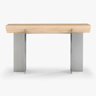 Front view of the Forma Atelier console table with an elongated Douglas fir top and two stainless steel supports.