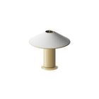 Table lamp with white shade and beige base on a white background