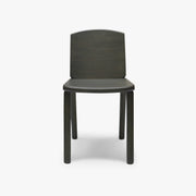 Front view of the Tachi dining chair in green aniline-stained solid ash with a shaped timber seat and backrest.