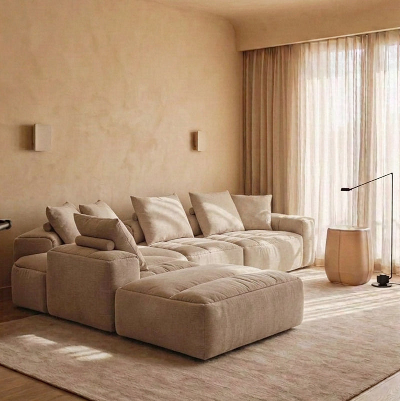RUE 5-piece L-shaped modular sofa with ottoman in River Clay upholstery, styled in a warm living room