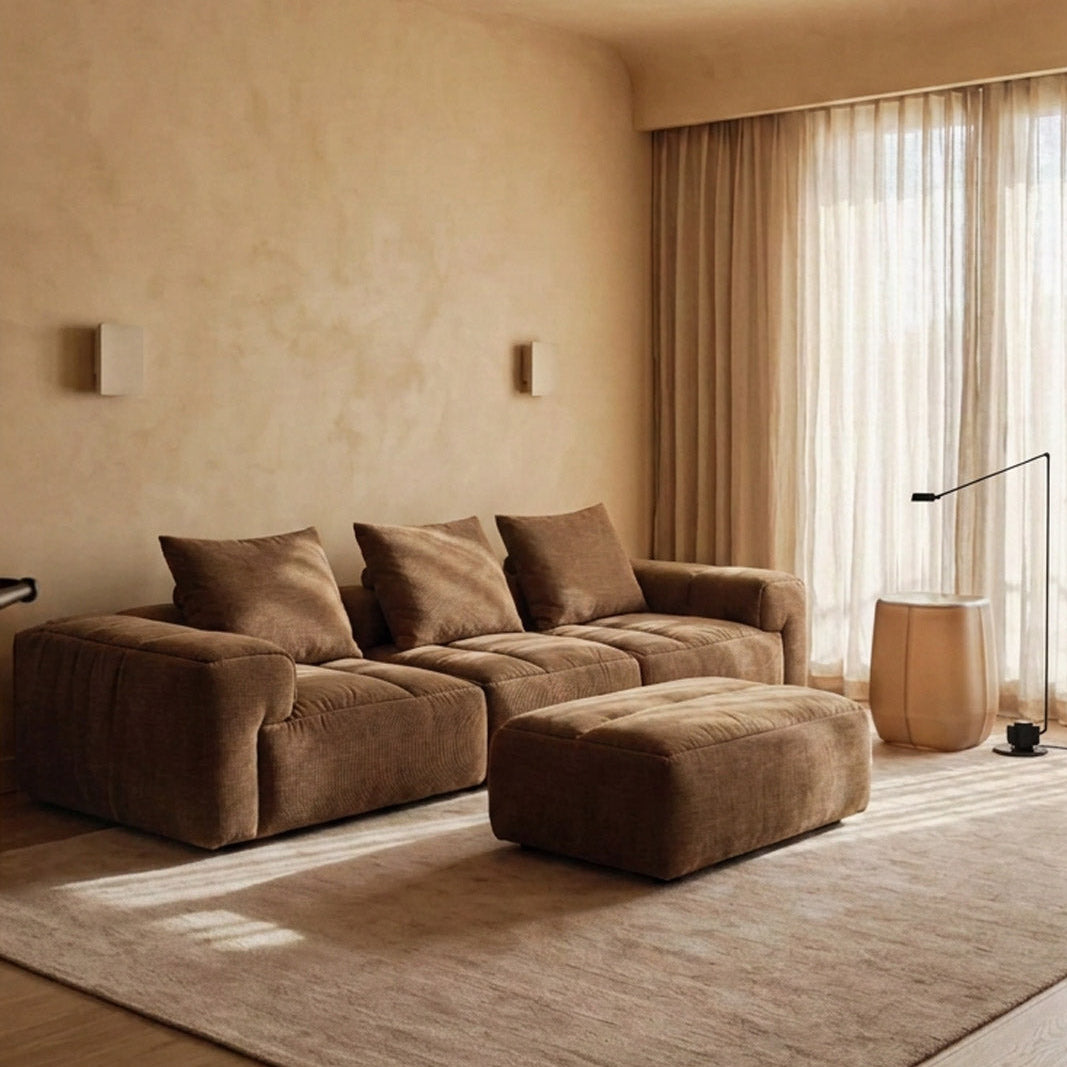 RUE 3-seat modular sofa with ottoman in Tundra upholstery, styled in a warm living room