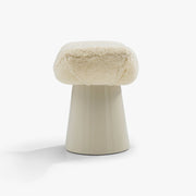 Rear three-quarter view of the Sela Stool with natural lambswool seat and Bone base