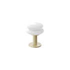 White shade and butter base portable table lamp on a white background