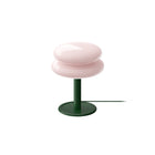Peach/Pink coloured shade with a deep green base  and deep green cord on a white background