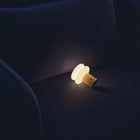 Small lamp on a dark fabric surface