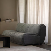 SOLACE armless two-seat module in Celestine upholstery in a softly lit modern living room