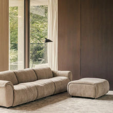 SOLACE 3-seat modular sofa and ottoman in River Clay upholstery in a warm modern living room